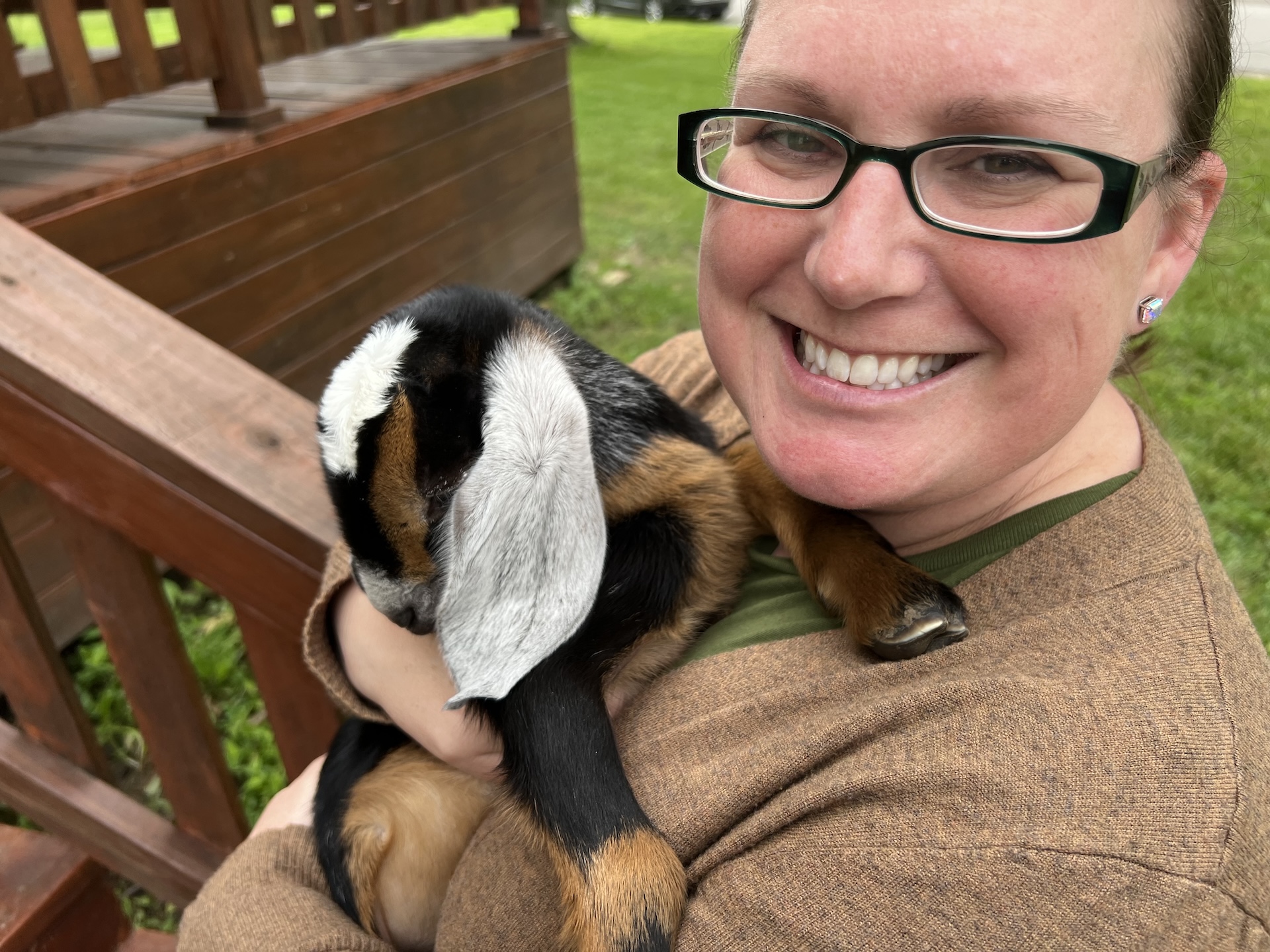 Image of IAUC Founder with a baby goat.
